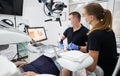 Dentist scanning patient's teeth with modern machine for intraoral scanning.