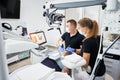 Dentist scanning patient& x27;s teeth with modern machine for intraoral scanning.