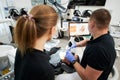 Dentist scanning patient's teeth with modern machine for intraoral scanning.