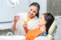 Dentist show dentures to a patient Royalty Free Stock Photo