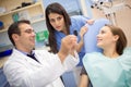 Dentist show film to his assistant in dental clinic