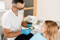 Dentist showing cast of teeth of patient woman before dental implantation. Procedure of creating dental prostheses Royalty Free Stock Photo