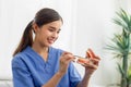 Dentist showing decayed tooth on prosthetic jaw and showing good position of teeth, oral health concept