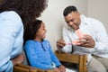 Dentist showing patient how to clean teeth