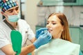 Dentist showing result of treatment for the patient. Royalty Free Stock Photo