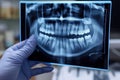 In dentist stomatologist examines x-ray of patient& x27;s teeth a jaw.
