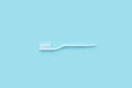 Dentist stomatology medical concept. Oral dental hygiene concept. New white toothbrush on blurred blue background. Close-up on a Royalty Free Stock Photo