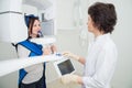 Dentist taking a panoramic digital X-ray of a patient s teeth Royalty Free Stock Photo