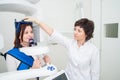 Dentist taking a panoramic digital X-ray of a patient s teeth Royalty Free Stock Photo