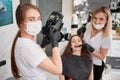 Dentist taking picture of female patient in dental office.