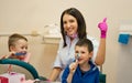 Dentist teaches children to brush their teeth