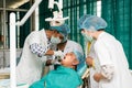 Dentist with team members at work