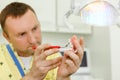 Dentist tests jaw using tool