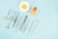 Dentist tools on the blue background.