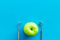 Dentist tools for cure teeth and apple on blue background top view copy space Royalty Free Stock Photo