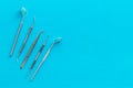 Dentist tools for cure teeth on blue background top view copy space Royalty Free Stock Photo