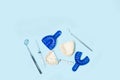 Dentist tools on a light blue background with copy space Royalty Free Stock Photo