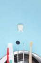 Dentist tools toothbrush, toothpaste and Tooth model on Blue background.. Dental equipment. Dental Care conceptual image Royalty Free Stock Photo
