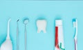 Dentist tools toothbrush, toothpaste and Tooth model on Blue background.. Dental equipment. Dental Care conceptual image Royalty Free Stock Photo