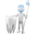 Dentist with a tooth and a mouth mirror Royalty Free Stock Photo