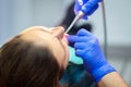 Dentist treat teeth of woman patient