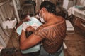 Dentist treating an indigenous woman in the Brazilian Amazon