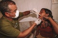 Dentist treating an indigenous woman in the Brazilian Amazon