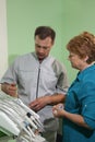 Dentist treating a patient`s teeth with dental tools in dental clinic. Dentistry.