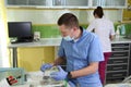 Dentist treating a patient`s teeth with dental tools in dental clinic. Dentistry. Royalty Free Stock Photo