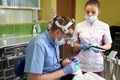 Dentist treating a patient`s teeth with dental tools in dental clinic. Dentistry. Royalty Free Stock Photo