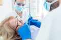 Dentist during treatment of a senior patient