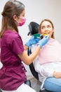 Dentist uses plastic molds to create impressions for orthodontic alignments in the dental office.