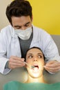 dentist using dentist mirror on patient mouth Royalty Free Stock Photo