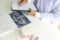 dentist work on the table with Denture and teeth x-ray Royalty Free Stock Photo