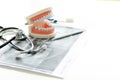 dentist work on the table with Denture and teeth x-ray Royalty Free Stock Photo