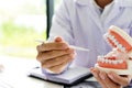 dentist work on the table with Denture and teeth x-ray Royalty Free Stock Photo