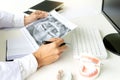 dentist work on the table with Denture and teeth x-ray Royalty Free Stock Photo