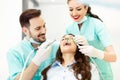 Dentist at work. Young female patient visiting dentist office