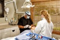 A dentist and dental hygienist working on a patients teeth