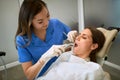 Dentist working with patient in dental chair