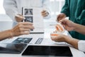 Dentist writing report working with tooth x-ray film model and equipment used in the treatment of dental Royalty Free Stock Photo