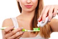 Woman applying toothpaste on her toothbrush Royalty Free Stock Photo