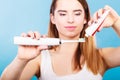 Woman applying toothpaste on her toothbrush Royalty Free Stock Photo