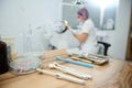 Dentistry. Dental practice. Modern dental tools, sterile stainless steel instruments on a wooden surface against a blurred Royalty Free Stock Photo