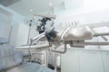 Dentistry, medicine, medical equipment and stomatology concept - close up of lamp and dental unit instruments clinic