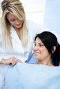 Dentists assistant preparing patient