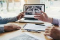 Dentists are discussing dental problems at report x-ray image on laptop screen to patients Royalty Free Stock Photo