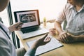 Dentists are discussing dental problems at report x-ray image on laptop screen to patients Royalty Free Stock Photo