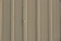 dents on brown corrugated metal sheet texture background Royalty Free Stock Photo