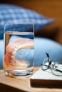 Denture in a glass.